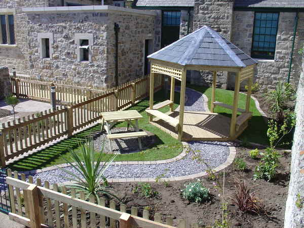 Landscape design with Pathway, seating and Arbour